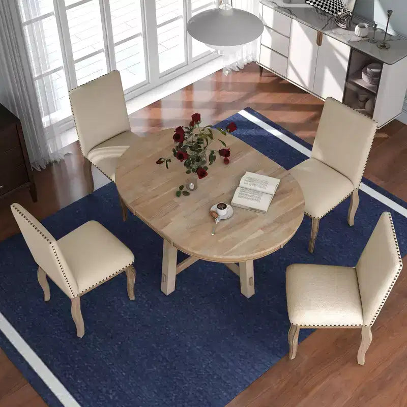 Ensemble de salle à manger 5 pièces Dana de GDFStudio avec table ronde extensible et chaises rembourrées